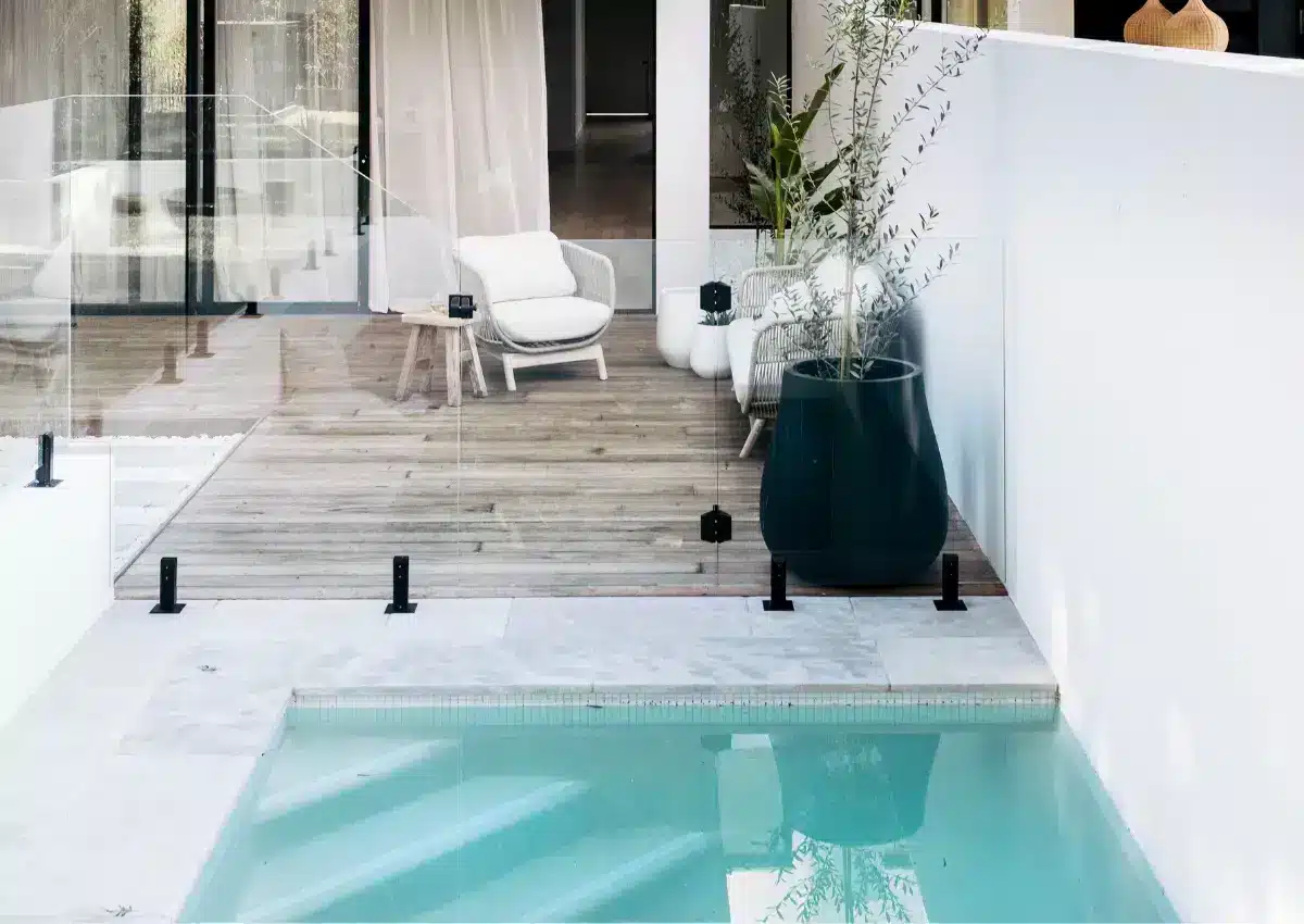 In-ground concrete pool with modern outdoor seating area at Duple residential project in NSW