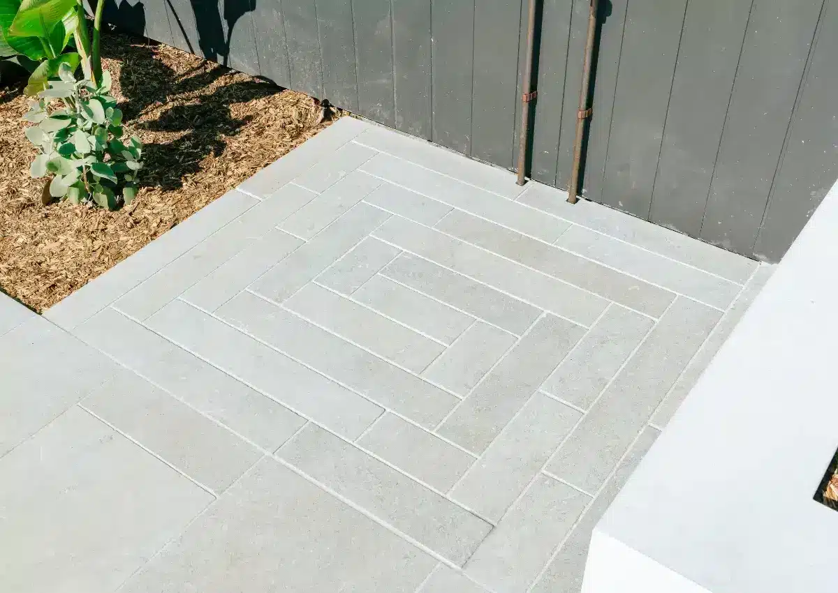 Concrete pool tiles with modern paving and landscaped details in a Kirrawee backyard