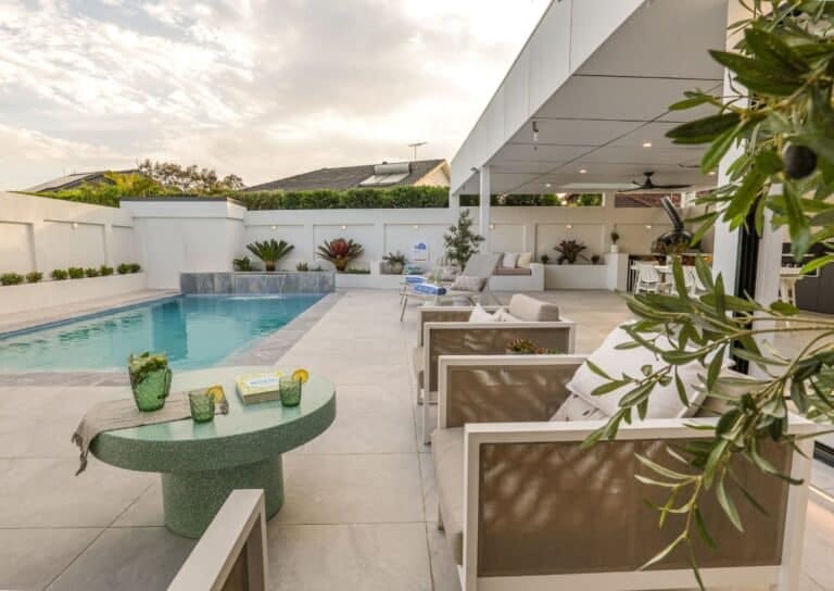 Mediterranean style concrete pool with outdoor lounge and terrace, custom built in NSW by Blue Haven Pools