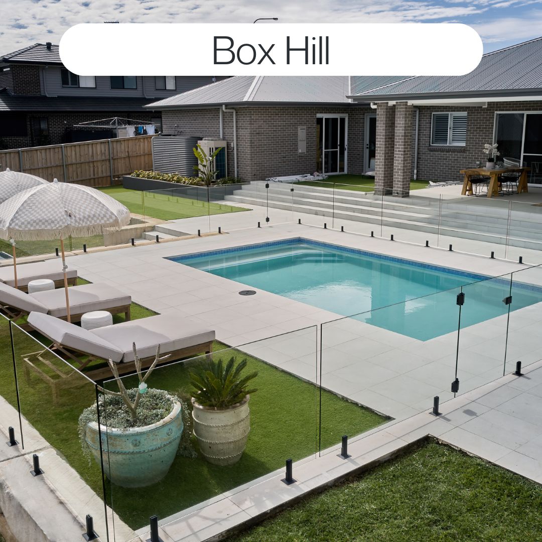 Family backyard swimming pool in Box Hill with glass fencing, outdoor entertaining area, sun lounges and modern landscaping