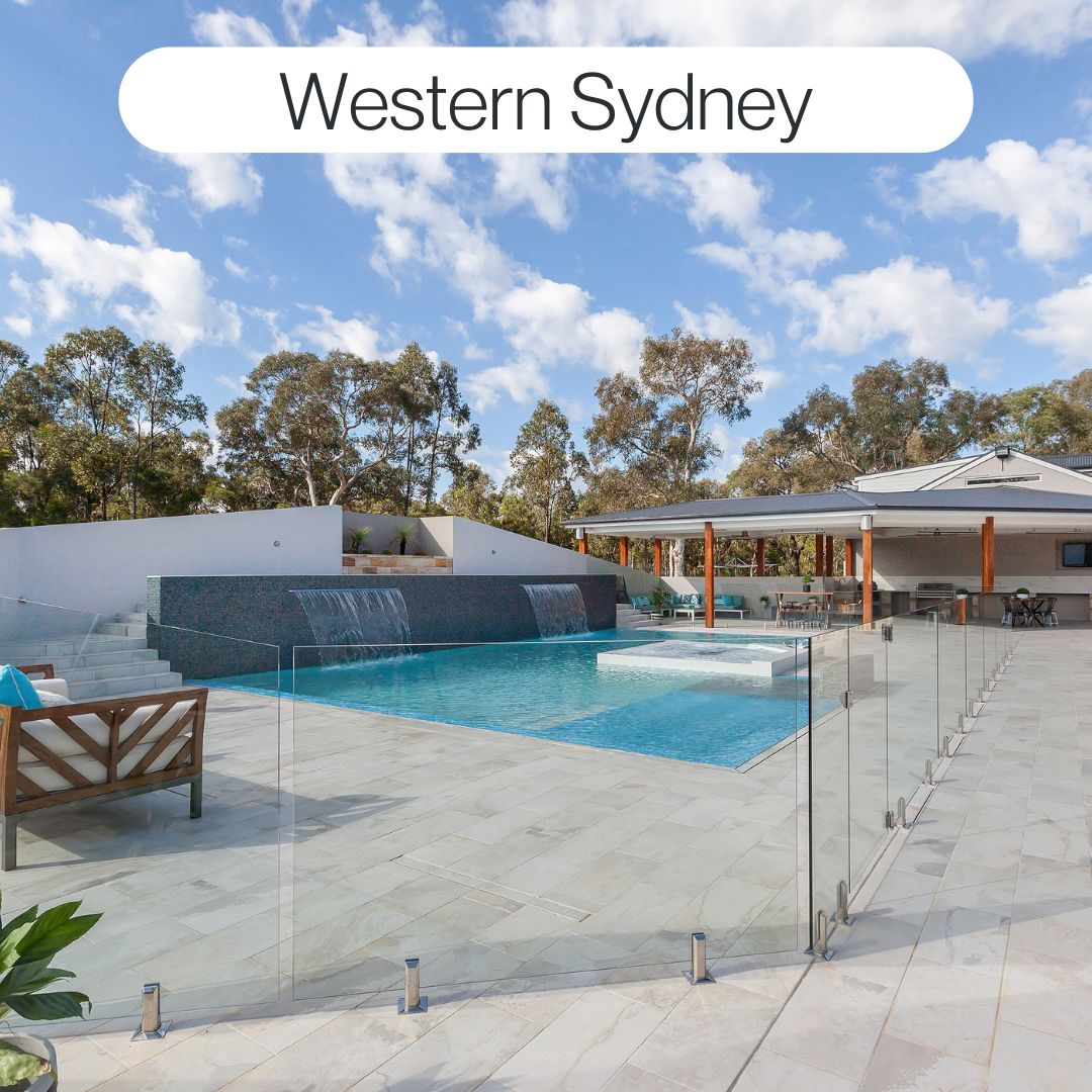 Large custom backyard swimming pool in Western Sydney with glass fencing, water features, spa and modern outdoor entertaining area