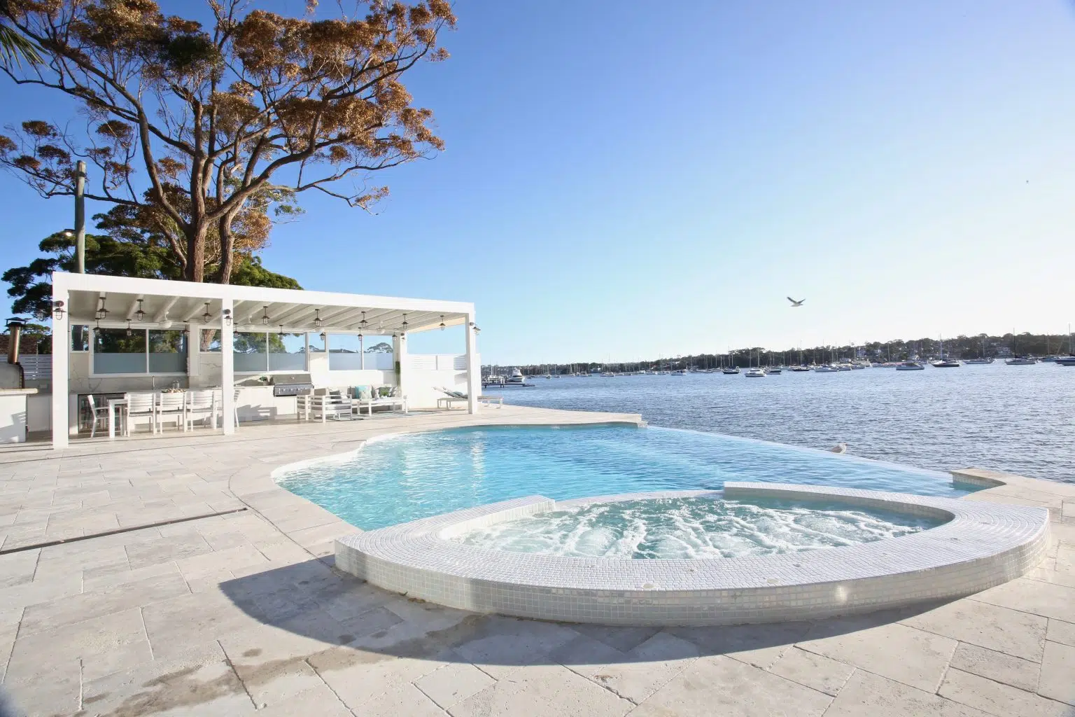 Waterfront concrete pool renovation with raised spa in Sans Souci, St George Sydney