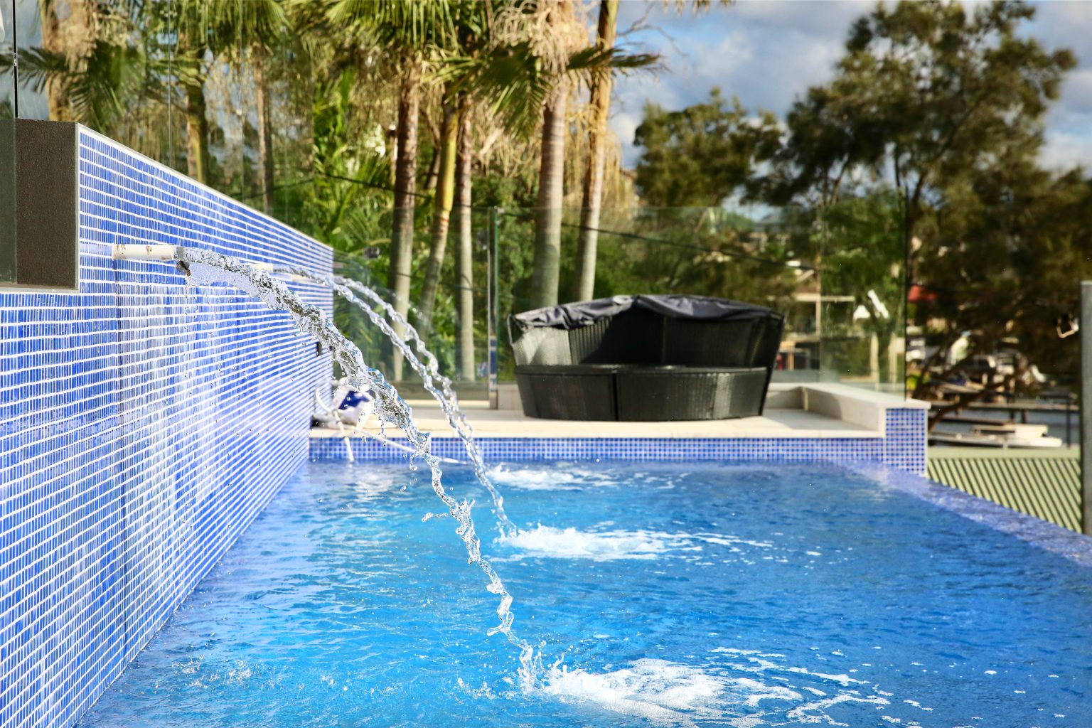The wet edge design helps connect the pool visually with the waterfront setting.
