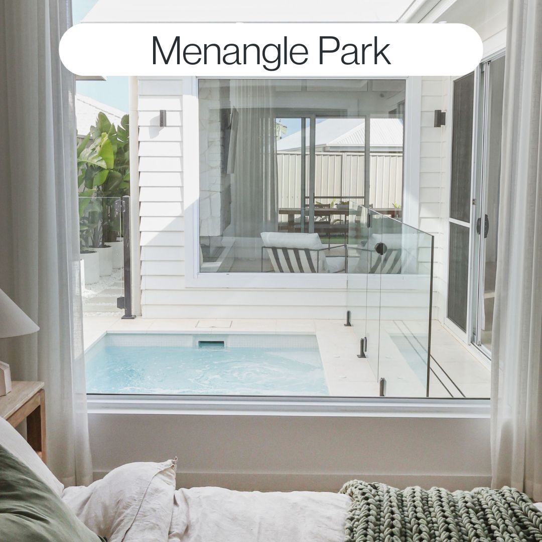 Small courtyard swimming pool in Menangle Park with glass fencing, modern home connection and compact outdoor living design
