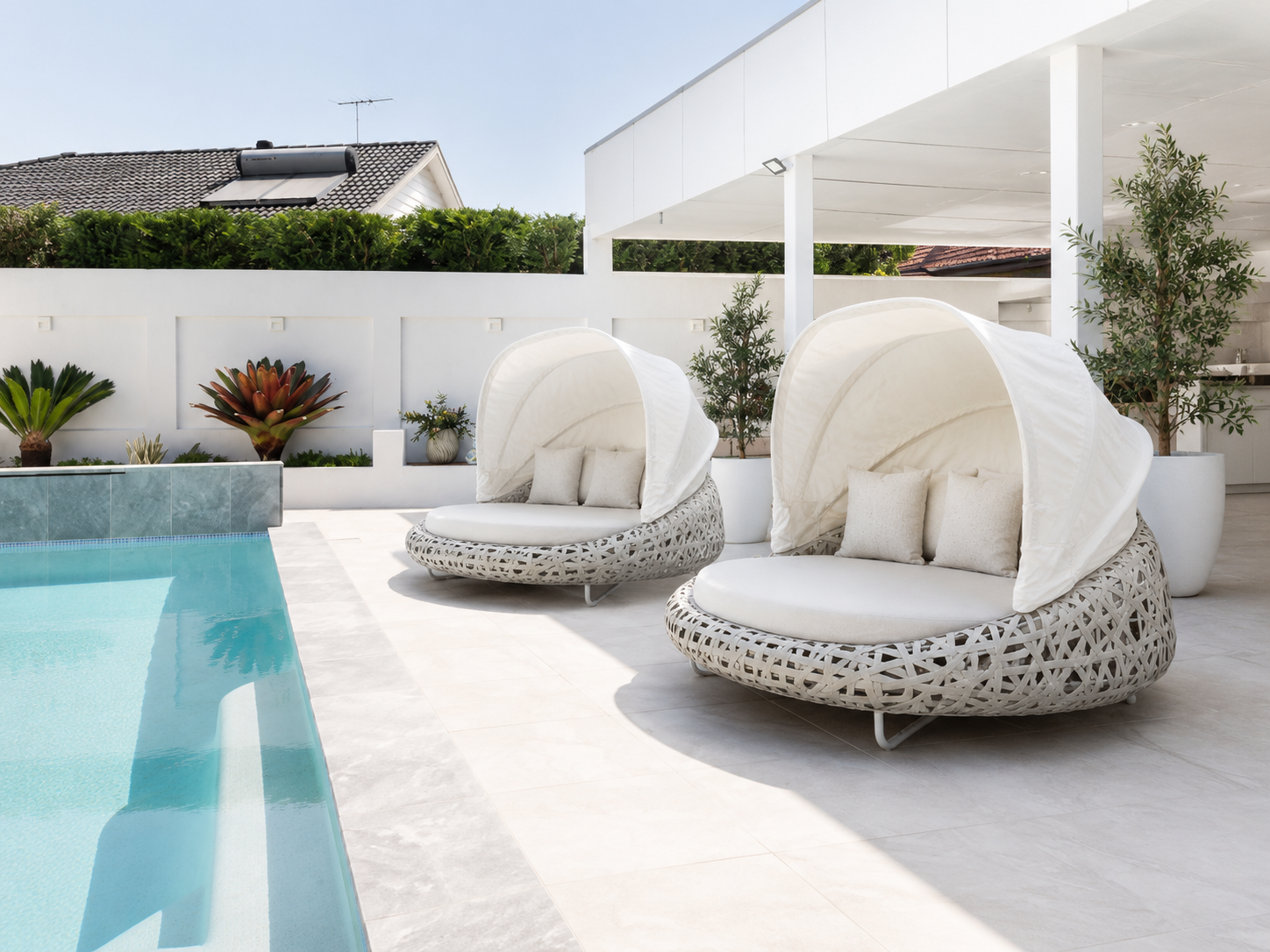 Premium outdoor poolside lifestyle with outdoor furniture beside a swimming pool