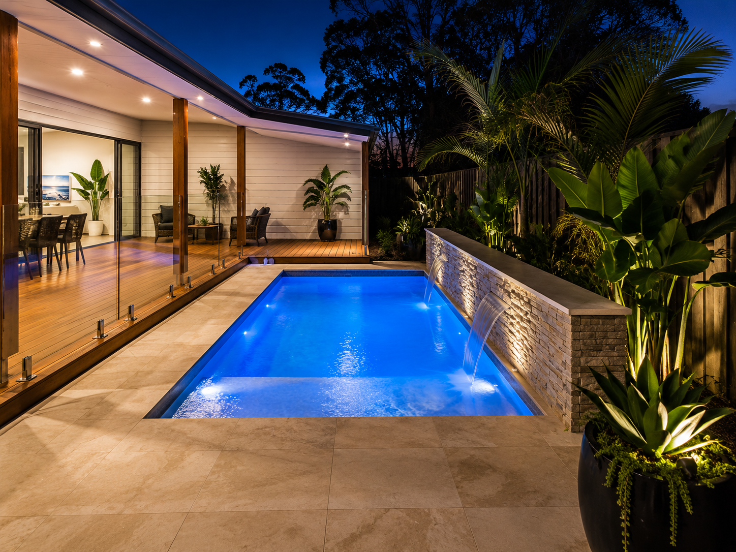Compact plunge pool illuminated with blue LED lighting in a Sydney backyard