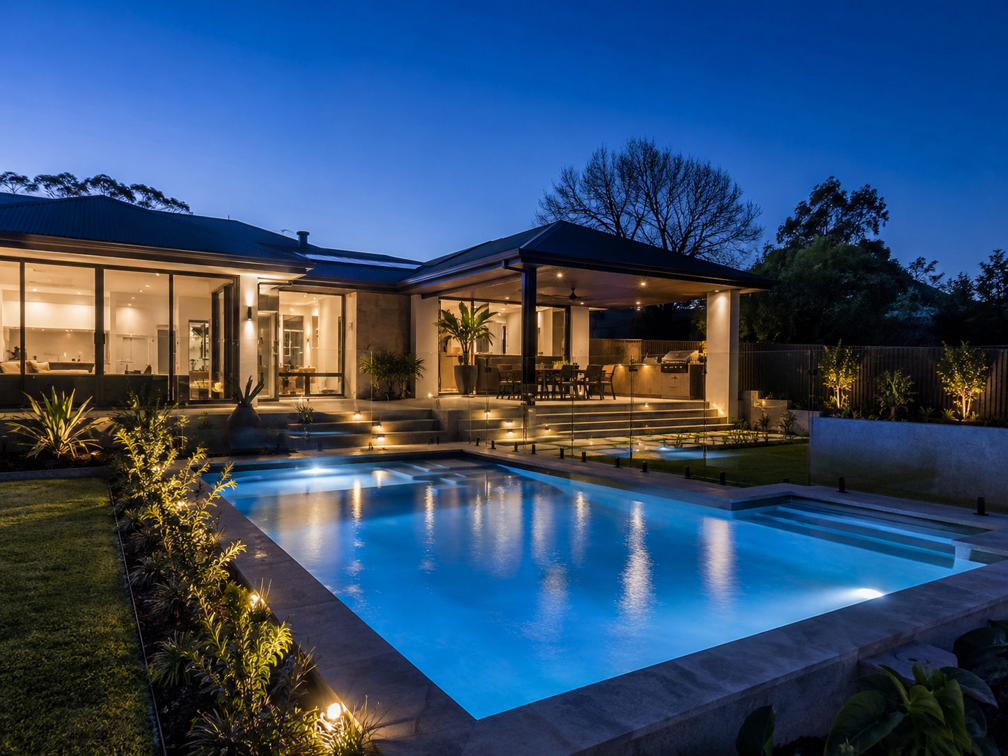 Modern Sydney swimming pool with integrated lighting at blue hour