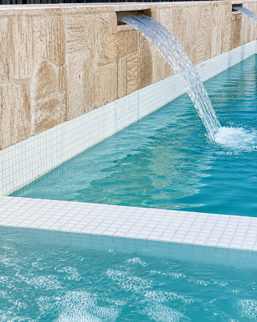 Pool step and riser tiles finishing detail by Blue Haven Pools