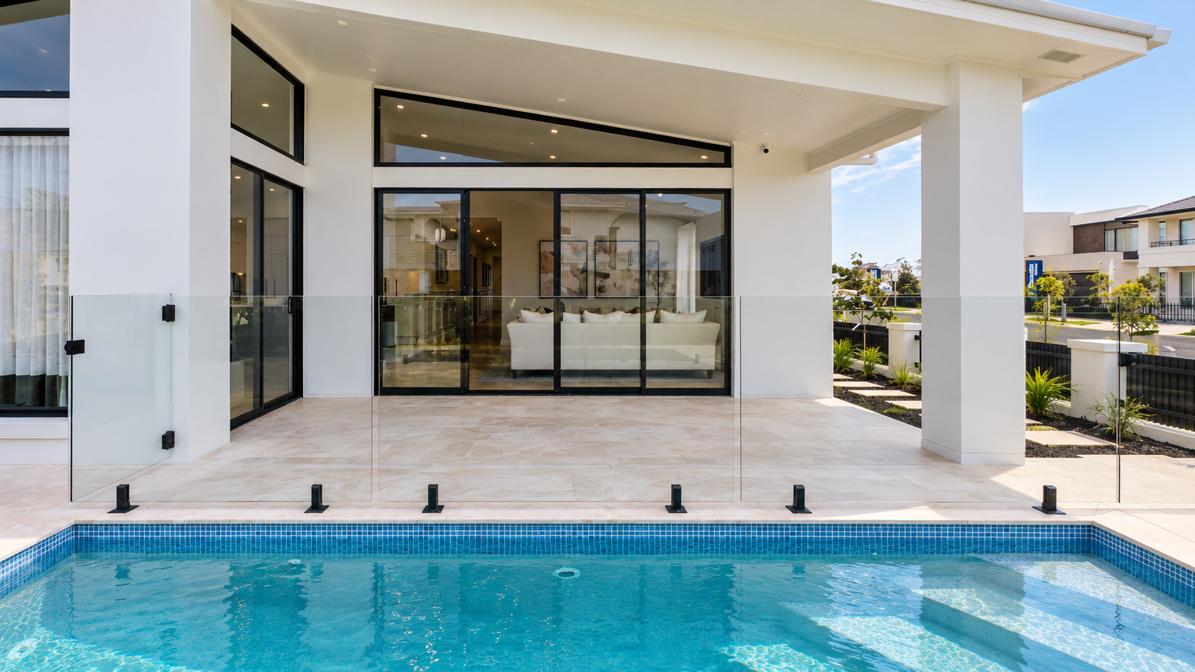 Modern concrete pool and backyard design at an Oran Park home in South Western Sydney